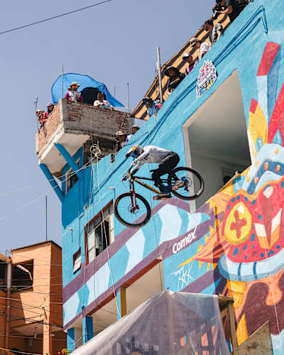 Pedro Burns cycles out of an upper floor of a building during Red Bull Cerro Abajo Guanajuato in Guanajuato, Mexico, on March 23, 2024
