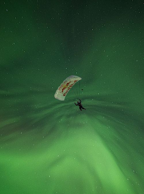 Jeffrey Provenzano skydiving under Alaska's Northern Lights