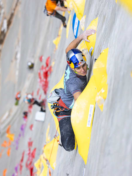 In 2023, Domen Škofic climbs the Red Bull Dual Ascent wall on the Verzasca Dam in Switzerland