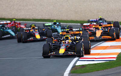 Max Verstappen leads Lando Norris at the start during the F1 Grand Prix of Netherlands at Circuit Zandvoort on August 25, 2024. 