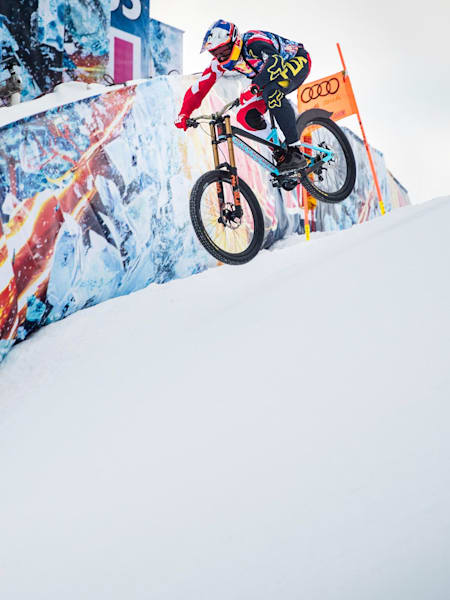 Mountain biker Max Stöckl attacks one of the Streif's jumps.