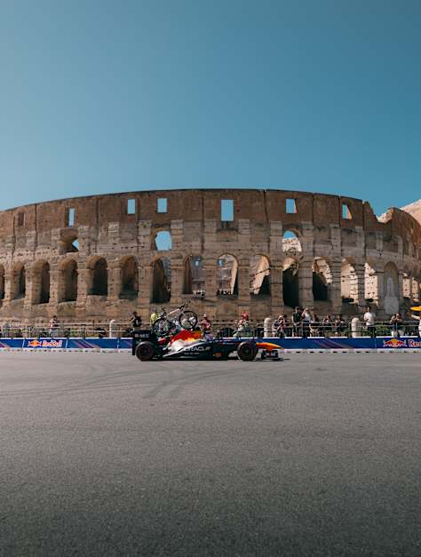 A F1 car in front of the Colosseum in Rome, Italy.