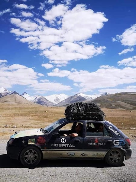 A photo of drum 'n' bass DJ Krakota taking part in the Mongol Rally.