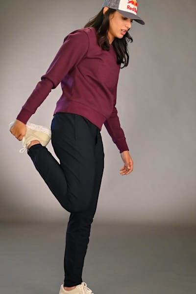 Indian opening batter Smriti Mandhana performs warm-up exercises before a workout.