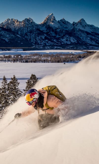 Michelle Parker flanks a turn in front of the Tetons in Jackson, Wyoming, USA on 7 February, 2019.
