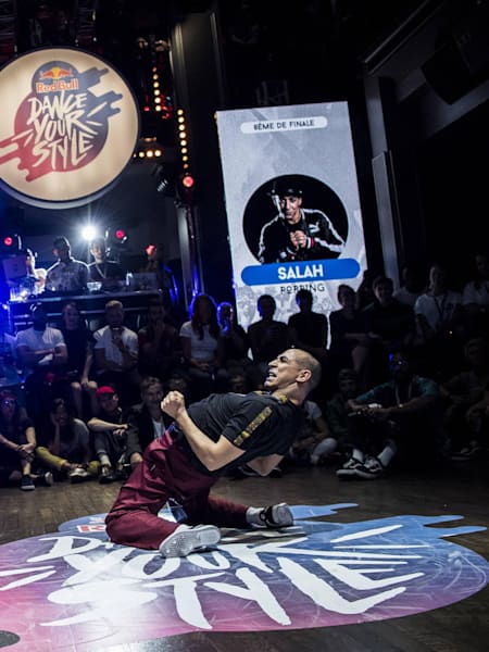 Salah shows a backbend move on the floor in Paris, France.