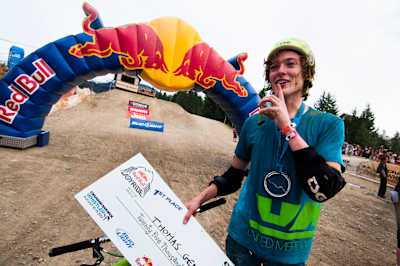 Thomas Genon celebrates with his cheque for $25,000 USD after winning Red Bull Joyride in Whistler, Canada in 2012. 