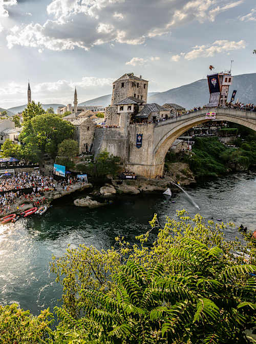 Pierrick Schafer of Switzerland dives from the 27.5-metre platform on Stari Most in Mostar during the 2026 Red Bull Cliff Diving World Series final competition day