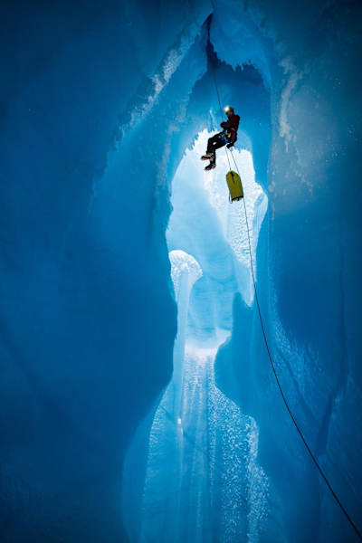 Climber Will Gadd slowly lowers himself into an ice cap during his trip to explore the Greenland ice cap in 2018.