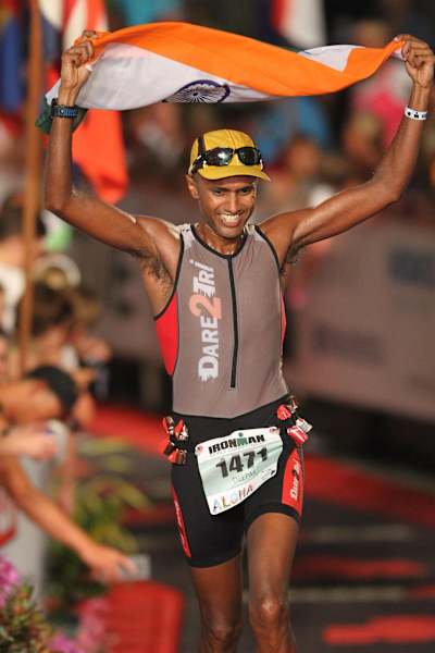 Deepak Raj crossing the finish line at the 2017 Ironman World Championship in Kona, Hawaii