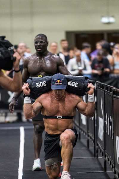 Noah Ohlsen takes on the gruelling sandbag lunges during the Hyrox World Championship in Chicago, Illinois, USA on June 15, 2025.