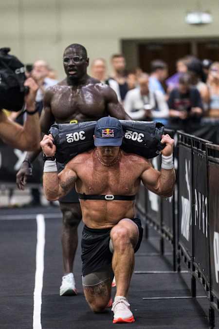 Noah Ohlsen takes on the gruelling sandbag lunges during the Hyrox World Championship in Chicago, Illinois, USA on June 15, 2025.