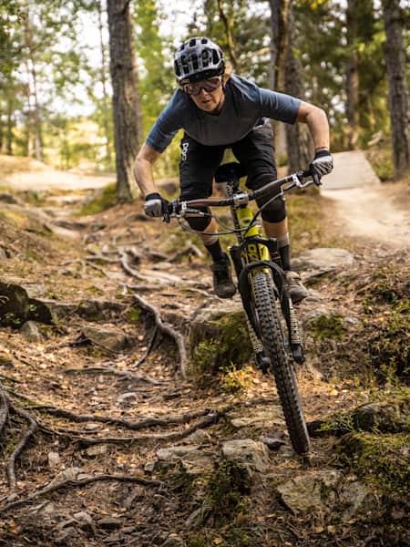 Lina Skoglund riding a technical section of trail in Flottsbro, Sweden, 2020.
