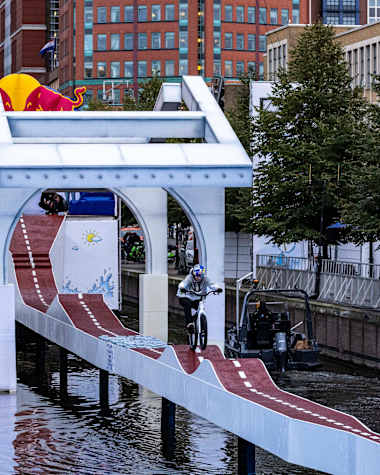 Fabio Wibmer on a bike, riding the Red Bull Stalen Ros floating track in The Hague, Netherlands