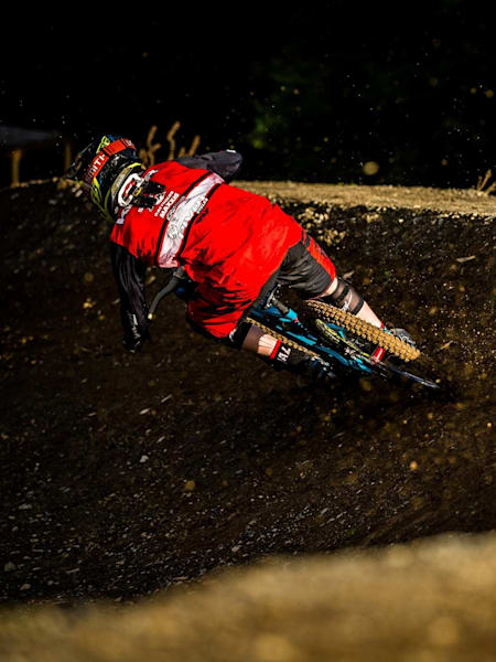 Mountain biker riding high corner