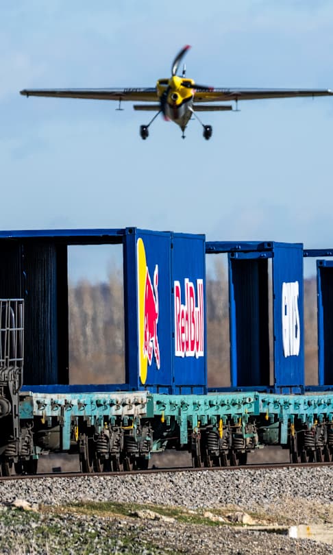 Dario Costa carefully approaches a train in his Zivko Edge 540 in Afyonkarahisar, Turkey, as he attempts to land on and and take off from a moving cargo train in February 2025.