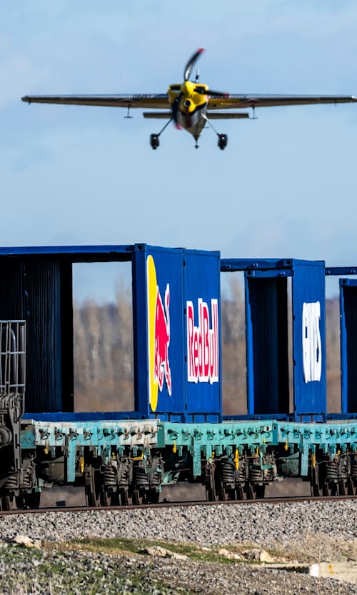 Dario Costa carefully approaches a train in his Zivko Edge 540 in Afyonkarahisar, Turkey, as he attempts to land on and and take off from a moving cargo train in February 2025.