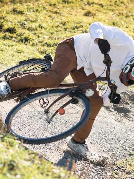 Fabio Wibmer rides down a trail on the Saalbach downhill course on a city bike