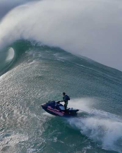 In 2024, Lucas Chianca surfs a massive wave in Nazaré, Portugal