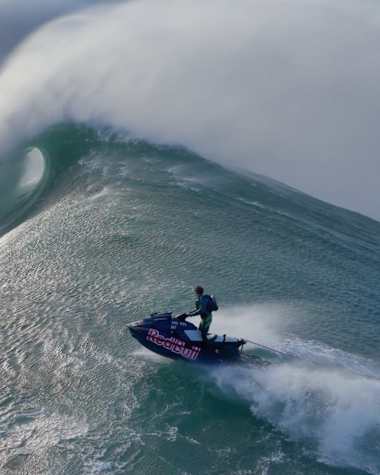 In 2024, Lucas Chianca surfs a massive wave in Nazaré, Portugal