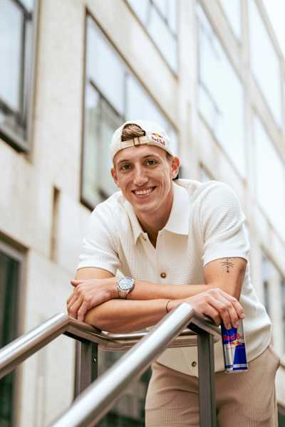 Swiss decathlete Simon Ehammer poses with a can of Red Bull.