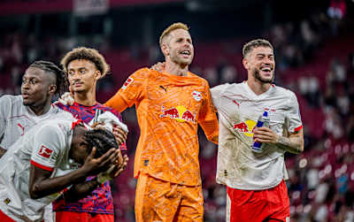 RB Leipzig keeper Péter Gulácsi is in a celebratory mood with his team-mates after a win.