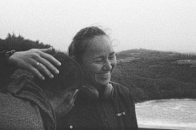 A back and white still image of surfer Carissa Moore from her movie RISS.