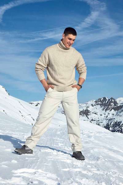 Franjo von Allmen poses on the mountainside with his hands in his pockets. 
