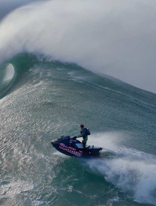 In 2024, Lucas Chianca surfs a massive wave in Nazaré, Portugal