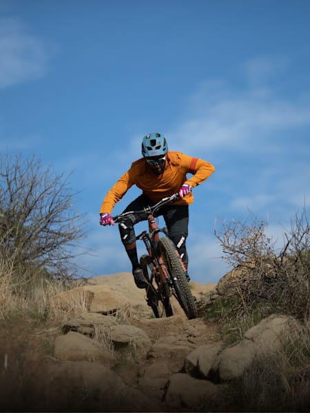 Eliot Jackson navigates a rocky mountain bike trail.