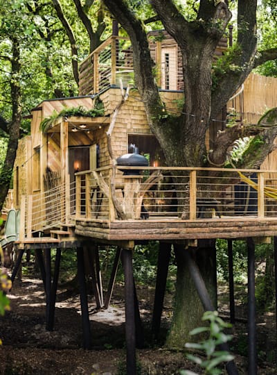 This hideaway includes a revolving woodburner, open-air shower and a slide