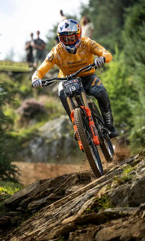 Gee Atherton races down rugged terrain at Red Bull Hardline in Dinas Mawddwy, Wales.