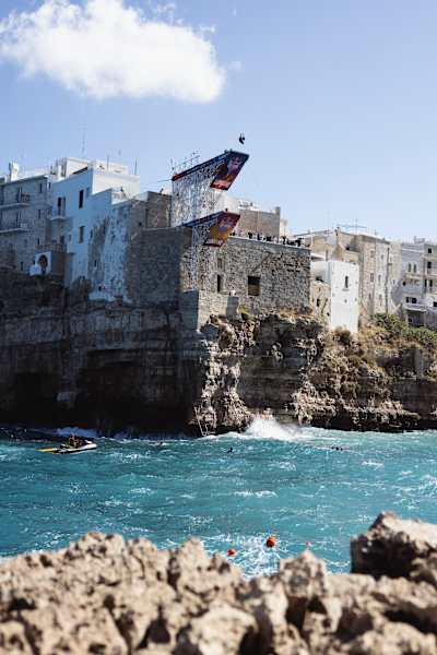 Sergio Guzman of Mexico launches from the 27-metre platform during the 2026 Red Bull Cliff Diving World Series final stop in Polignano a Mare, Italy