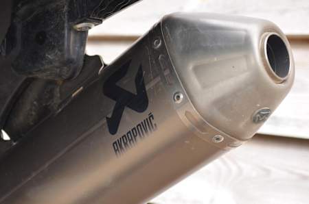 Close up of an MX bike high performance exhaust