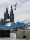 The highlight of the FMX Unloaded Rhine Line features Luc Ackermann performing a Tsunami Backflip between two barges sailing on the Rhine.