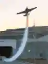 In 2021, Dario Costa performs a daring wingsuit flight through tunnels in Istanbul, trailing smoke behind him