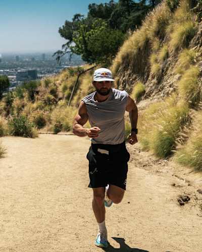 Arda Saaçti running up a hill for the ultrarunning challenge Red Bull Cyborg Season 2026