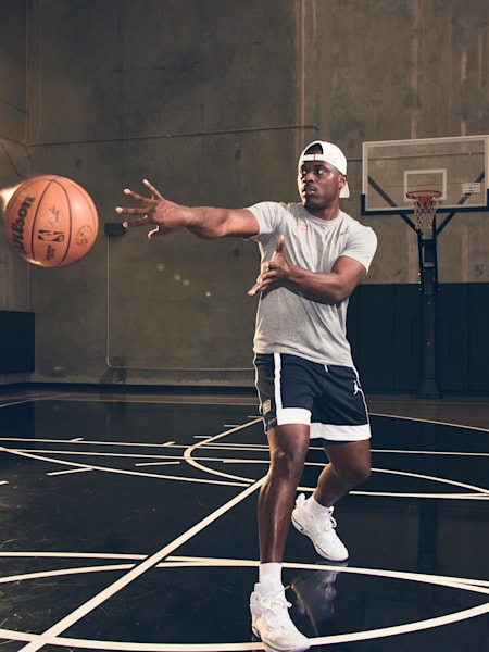 Basketball player Lethal Shooter passes the ball.