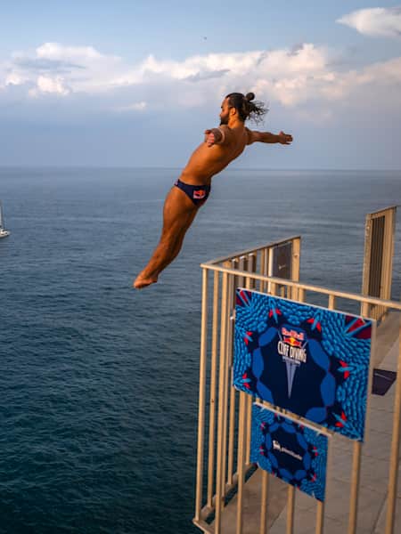 Catalin Preda dives from the 25.5m private balcony in Polignano a Mare, Italy on June 30, 2023. 