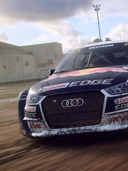 An Audi in DiRT Rally 2.0 sprays up mud while cornering.