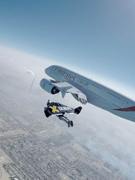 Jetmen Yves Rossy and Vince Reffet fly next to an Airbus 