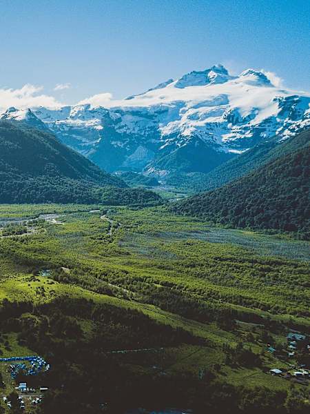 Looking across a valley towards a snow-capped mountain in Patagonia.
