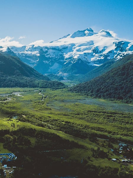 Looking across a valley towards a snow-capped mountain in Patagonia.
