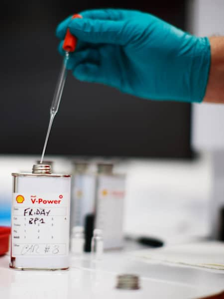 A photo of Shell fuel technicians working the in their lab at the 2010 Spanish F1 Grand Prix.