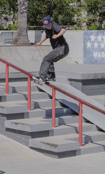 Frontside Boardsliding a tall thin railing in California