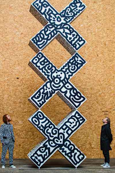 British artist Sam Cox, aka Mr Doodle, views an artwork he created at the STRAAT Museum in Amsterdam, the Netherlands in April 2023.