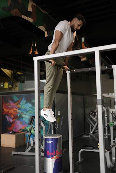 Kochi fitness trainer Nipun Viju performs calisthenics exercises in a gym.