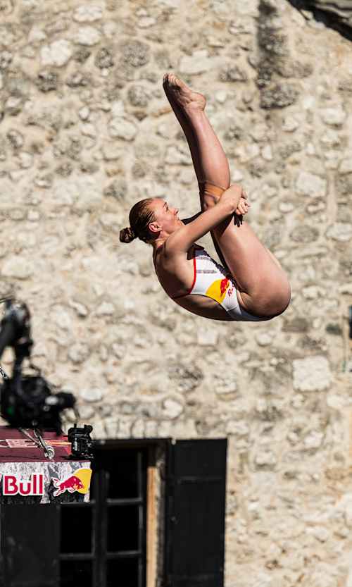 Molly Carlson of Canada performs a spectacular dive from the 21.5-metre Stari Most platform during the 2026 Red Bull Cliff Diving World Series in Mostar, Bosnia and Herzegovina.