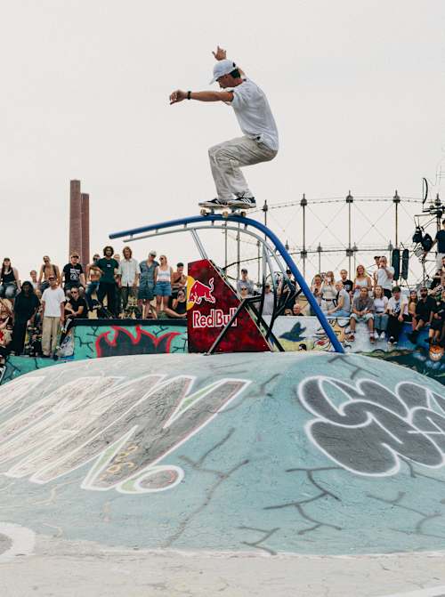 Danny León performs a spectacular skateboard move above a graffiti-covered ramp at the Red Bull Södervik Mästare competition in Helsinki in July 2026.