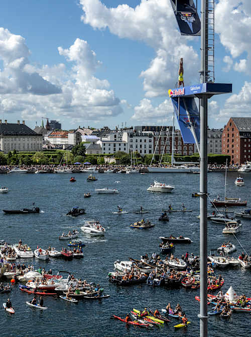 Ukrainian diver Antonina Vyshyvanova performs an armstand dive from 21.5 metres at the Copenhagen Opera House during the thrilling 2022 Red Bull Cliff Diving World Series event
